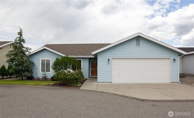 6 Laguna Pl W, Omak, WA 98841 - ranch-style house featuring a garage, concrete driveway, and a shingled roof