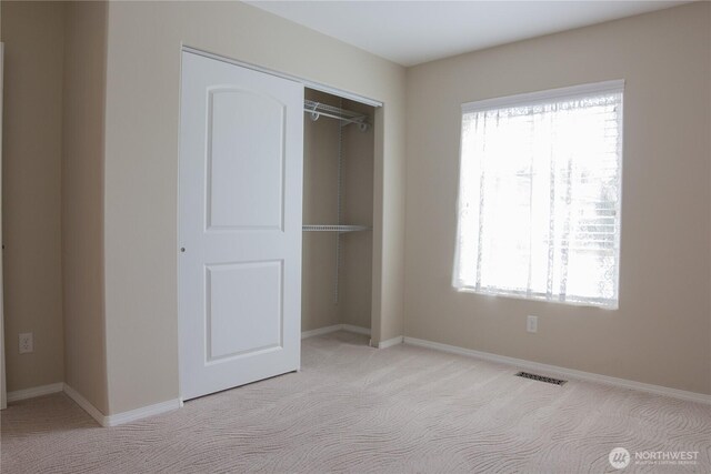 6 Laguna Pl W, Omak, WA 98841 - unfurnished bedroom with carpet, a closet, and baseboards