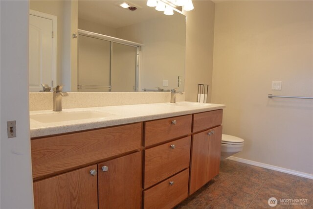 6 Laguna Pl W, Omak, WA 98841 - full bath featuring double vanity, baseboards, toilet, and a shower stall