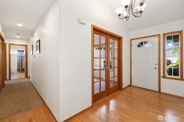 15427 148th Avenue Ct E, Orting, WA 98360 - foyer entrance featuring light wood-type flooring, a chandelier, french doors, baseboards, and recessed lighting