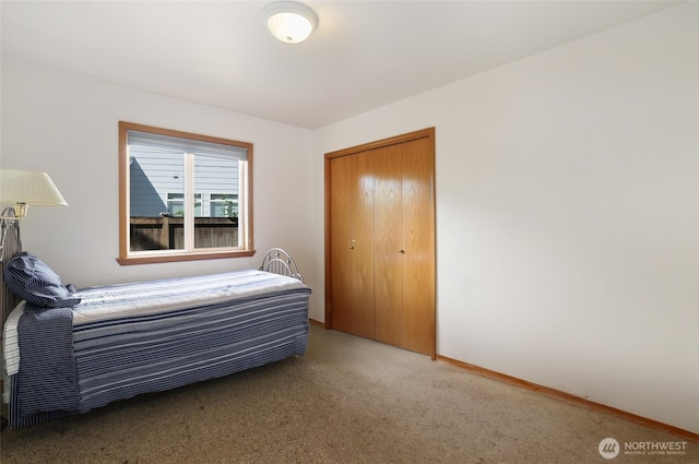 15427 148th Avenue Ct E, Orting, WA 98360 - bedroom featuring carpet flooring, a closet, and baseboards