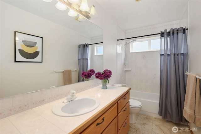 15427 148th Avenue Ct E, Orting, WA 98360 - full bathroom with vanity, toilet, shower / bath combo with shower curtain, a chandelier, and tile patterned flooring