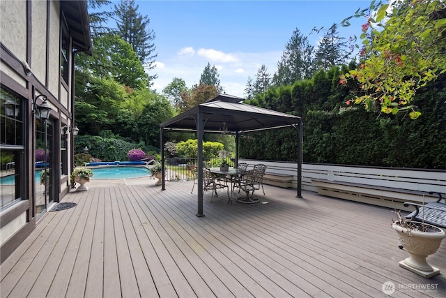 21102 31st Ave SE, Bothell, WA 98021 - deck with a gazebo, outdoor dining space, and view of wooded area