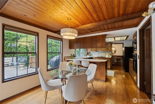 21102 31st Ave SE, Bothell, WA 98021 - dining room featuring wooden ceiling with exposed beams, light wood finished floors, and baseboards