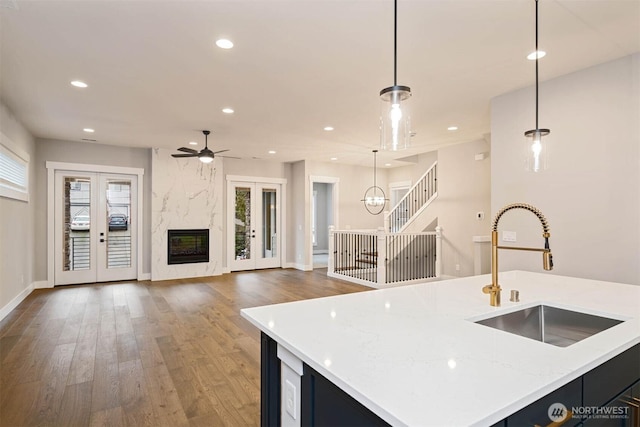 13037 75th Pl S, Seattle, WA 98178 - kitchen with a sink, french doors, wood finished floors, open floor plan, and a ceiling fan