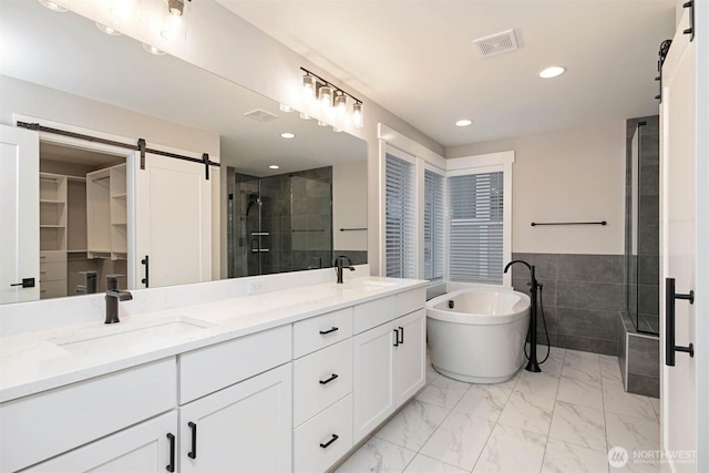 13037 75th Pl S, Seattle, WA 98178 - bathroom with a shower stall, double vanity, a soaking tub, recessed lighting, and marble finish floors