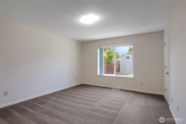 1210 24th St SE, Auburn, WA 98002 - empty room featuring carpet floors and baseboards