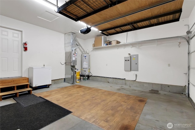1210 24th St SE, Auburn, WA 98002 - garage with water heater, electric panel, a garage door opener, and refrigerator