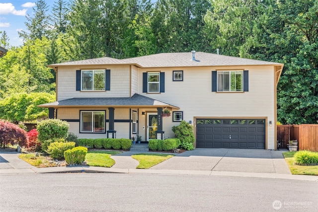 4492 Fantail Pl SW, Port Orchard, WA 98367 - view of front of house featuring a garage, concrete driveway, a porch, and roof with shingles