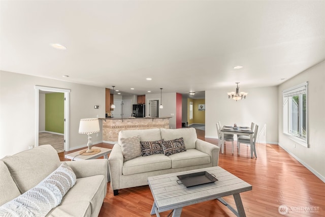 4492 Fantail Pl SW, Port Orchard, WA 98367 - living area with a chandelier, light wood-style flooring, baseboards, and recessed lighting