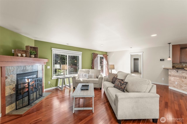 4492 Fantail Pl SW, Port Orchard, WA 98367 - living area featuring a fireplace, baseboards, hardwood / wood-style floors, and recessed lighting