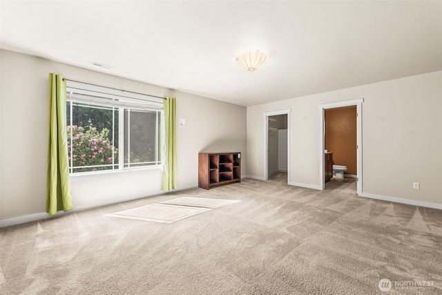 4492 Fantail Pl SW, Port Orchard, WA 98367 - unfurnished bedroom with carpet, a walk in closet, and baseboards