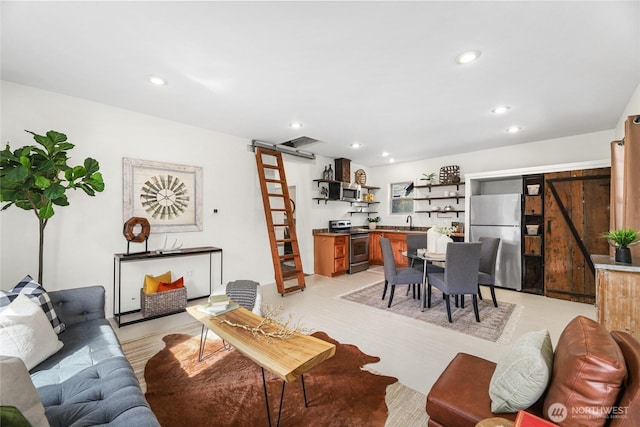 123 5th St, Roslyn, WA 98941 - living room with a barn door, recessed lighting, and light wood-style flooring