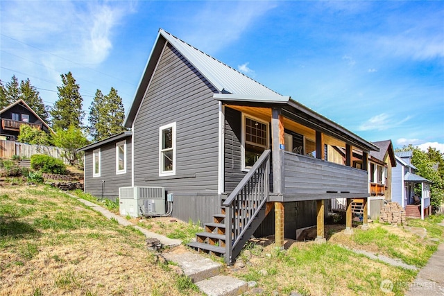 123 5th St, Roslyn, WA 98941 - view of home's exterior featuring stairway, central AC, and metal roof