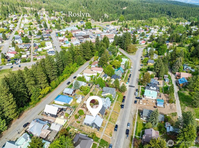 123 5th St, Roslyn, WA 98941 - aerial view of property and surrounding area featuring a heavily wooded area and nearby suburban area