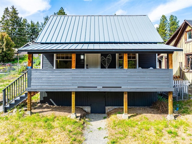123 5th St, Roslyn, WA 98941 - rear view of property with a standing seam roof, metal roof, and stairs