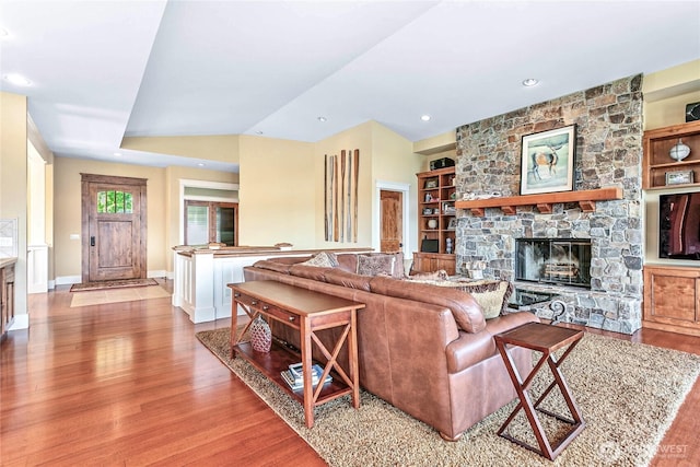3178 Edgewood Ln, Bellingham, WA 98226 - living room with wood finished floors, a stone fireplace, baseboards, built in shelves, and recessed lighting