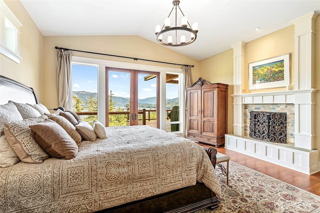 3178 Edgewood Ln, Bellingham, WA 98226 - bedroom featuring vaulted ceiling, a chandelier, french doors, wood finished floors, and a mountain view