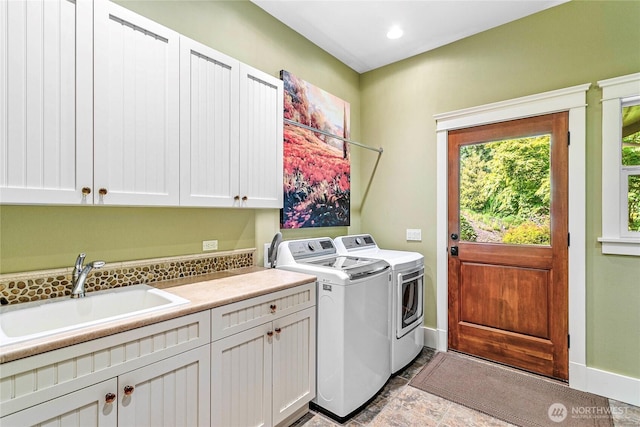 3178 Edgewood Ln, Bellingham, WA 98226 - laundry room featuring cabinet space, washing machine and clothes dryer, baseboards, stone finish flooring, and recessed lighting
