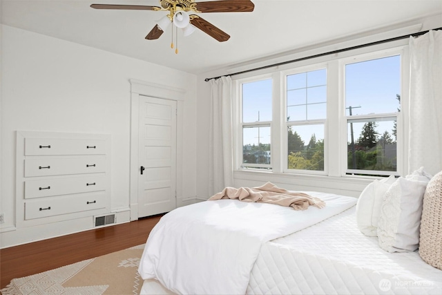 2416 Broadway, Bellingham, WA 98225 - bedroom with multiple windows, wood finished floors, and ceiling fan