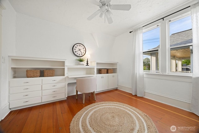 2416 Broadway, Bellingham, WA 98225 - living area featuring wood-type flooring, ceiling fan, and baseboards