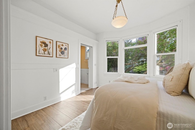 2416 Broadway, Bellingham, WA 98225 - bedroom with multiple windows, wood finished floors, and baseboards