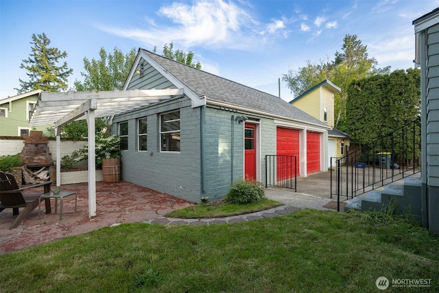2416 Broadway, Bellingham, WA 98225 - view of outdoor structure with a fireplace, a garage, and a pergola