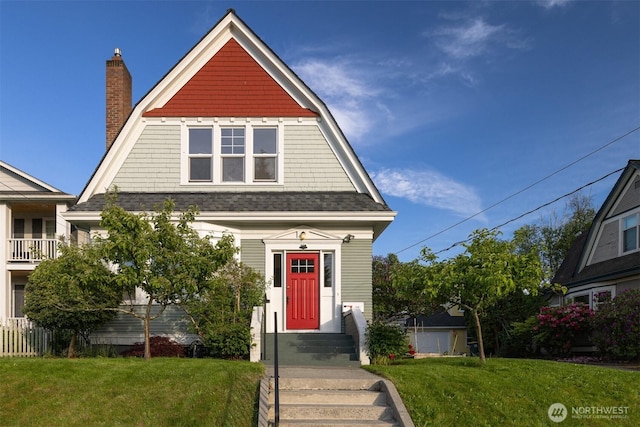 2416 Broadway, Bellingham, WA 98225 - view of front of property with a chimney, a front yard, and roof with shingles
