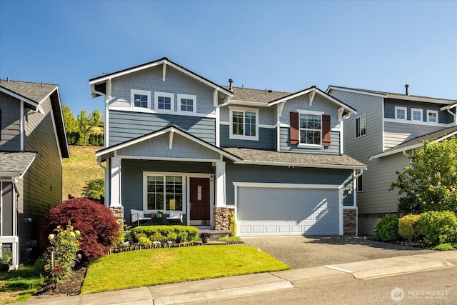 25356 SE 279th Pl, Maple Valley, WA 98038 - craftsman house featuring covered porch, driveway, an attached garage, roof with shingles, and stone siding