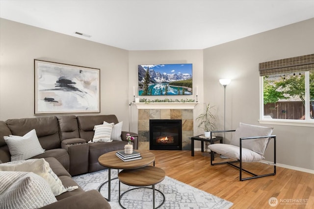 25356 SE 279th Pl, Maple Valley, WA 98038 - living area with light wood-type flooring, a fireplace, and baseboards