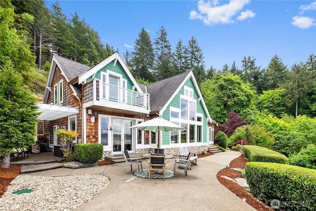 4590 E State Route 106, Union, WA 98592 - back of house with french doors, entry steps, a patio, and roof with shingles