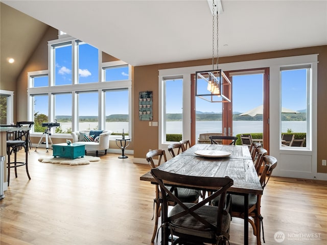 4590 E State Route 106, Union, WA 98592 - dining space with a chandelier, plenty of natural light, light wood-style flooring, and a water view