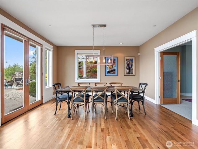 4590 E State Route 106, Union, WA 98592 - dining space with baseboards, light wood-style flooring, and french doors