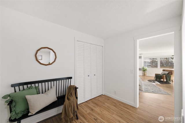 2553 Mackenzie Rd, Bellingham, WA 98226 - bedroom featuring wood finished floors, baseboards, and a closet