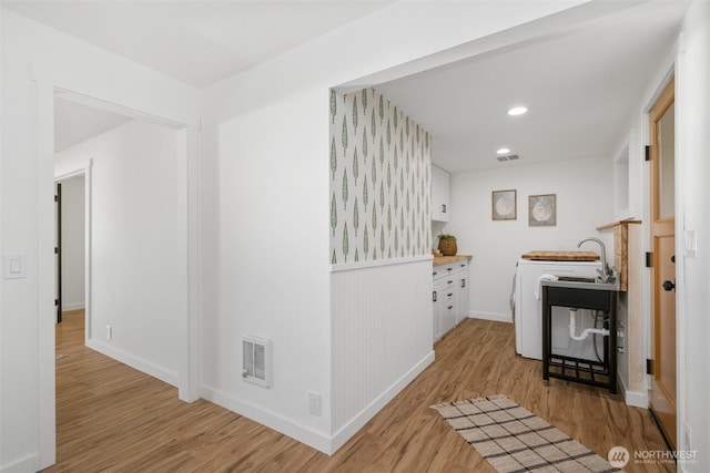 2553 Mackenzie Rd, Bellingham, WA 98226 - laundry area with light wood-type flooring, baseboards, and recessed lighting