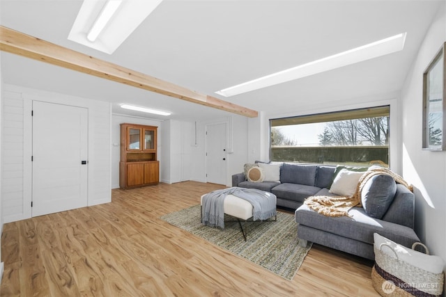 2553 Mackenzie Rd, Bellingham, WA 98226 - living room featuring a skylight, wood finished floors, and beamed ceiling