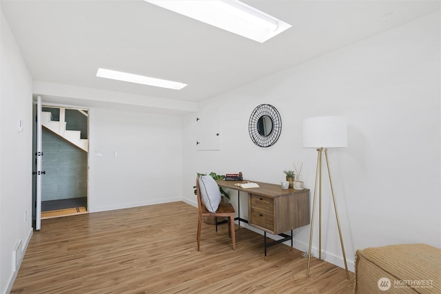 2553 Mackenzie Rd, Bellingham, WA 98226 - office area featuring a skylight, wood finished floors, and baseboards