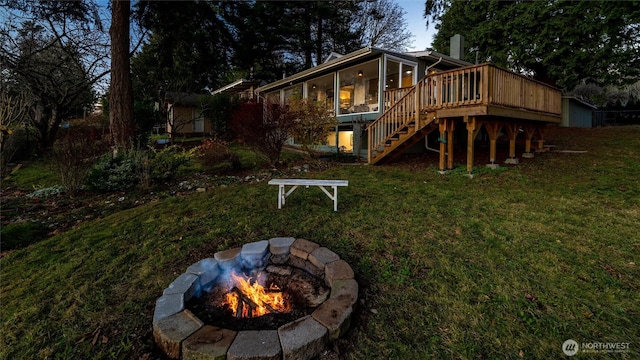 2553 Mackenzie Rd, Bellingham, WA 98226 - back of house featuring stairs, a fire pit, a lawn, and a wooden deck