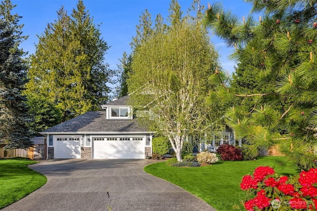 20160 Bue Rund Loop NE, Poulsbo, WA 98370 - view of property hidden behind natural elements with stone siding, asphalt driveway, and an attached garage