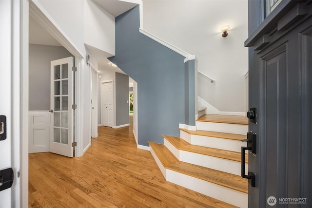 20160 Bue Rund Loop NE, Poulsbo, WA 98370 - foyer entrance with light wood finished floors, stairway, and baseboards