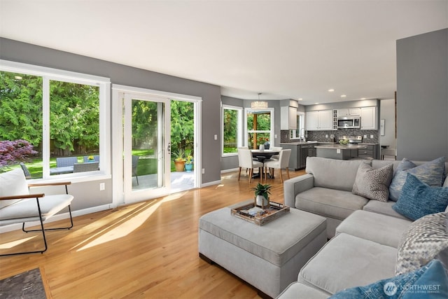 20160 Bue Rund Loop NE, Poulsbo, WA 98370 - living area with light wood-style flooring, baseboards, and recessed lighting
