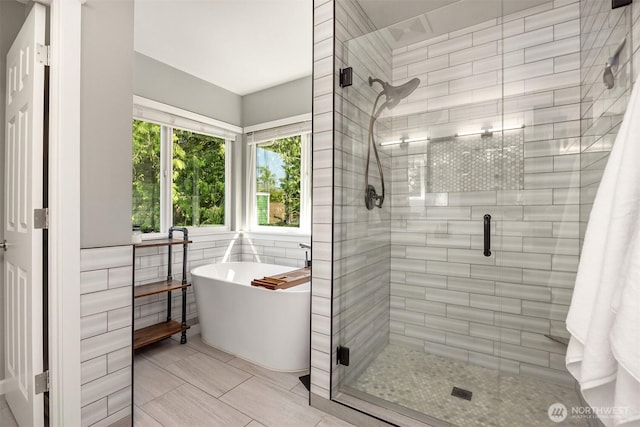 20160 Bue Rund Loop NE, Poulsbo, WA 98370 - full bath with a soaking tub, a stall shower, and tile patterned floors