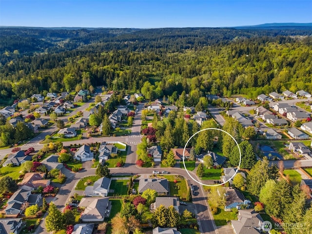 20160 Bue Rund Loop NE, Poulsbo, WA 98370 - aerial overview of property's location with a heavily wooded area and nearby suburban area