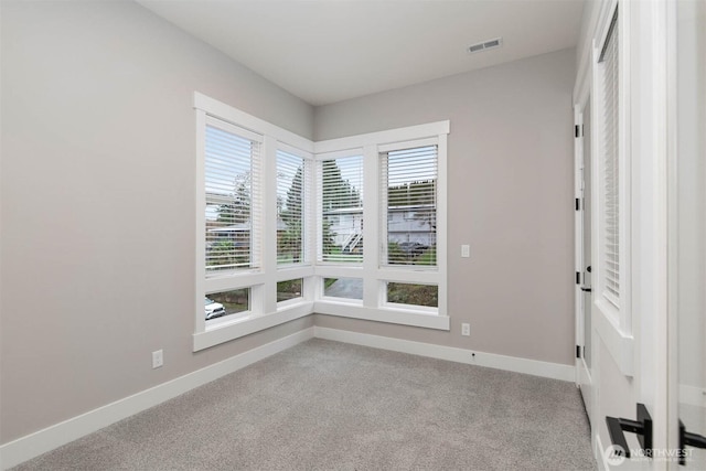 7545 S 129th Pl, Seattle, WA 98178 - unfurnished room with baseboards, healthy amount of natural light, and carpet flooring