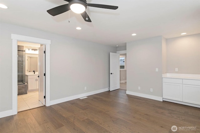 7545 S 129th Pl, Seattle, WA 98178 - spare room featuring wood finished floors, a ceiling fan, baseboards, and recessed lighting