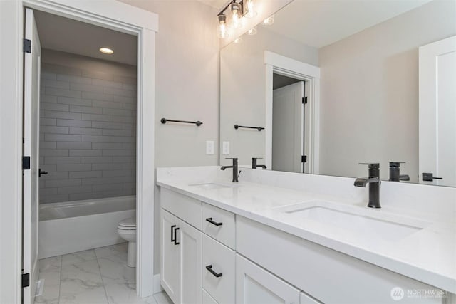 7545 S 129th Pl, Seattle, WA 98178 - full bath featuring double vanity, marble look tiles, toilet, recessed lighting, and shower / tub combination