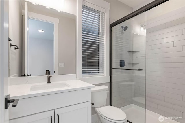 7545 S 129th Pl, Seattle, WA 98178 - full bathroom with toilet, a tile shower, and vanity