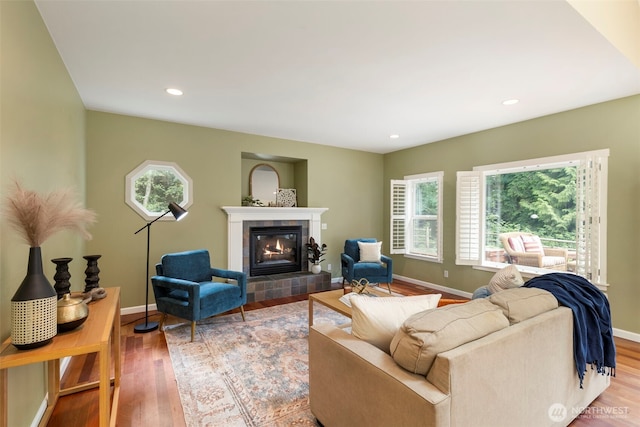 31199 Laughing Dog Ave NE, Poulsbo, WA 98370 - living area with a tile fireplace, wood finished floors, and recessed lighting