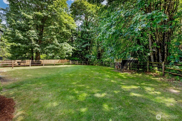 31199 Laughing Dog Ave NE, Poulsbo, WA 98370 - fenced backyard featuring an outbuilding
