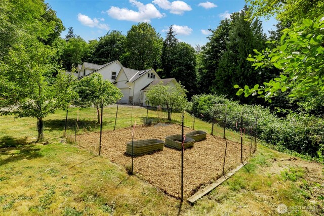 31199 Laughing Dog Ave NE, Poulsbo, WA 98370 - view of grassy yard featuring a garden
